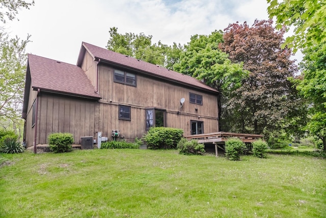 5N683 Ravine Dr, Saint Charles, IL 60175 - back of property with a yard, a shingled roof, a wooden deck, and central AC unit