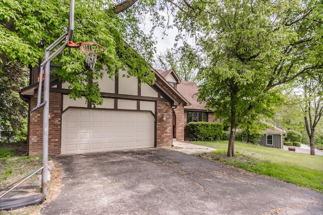 5N683 Ravine Dr, Saint Charles, IL 60175 - view of front facade with brick siding, driveway, a front yard, and a garage