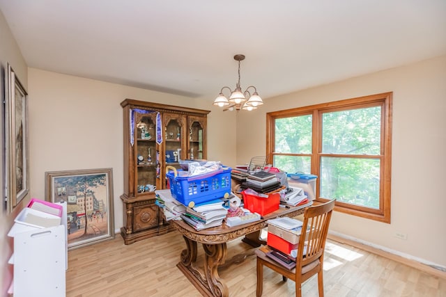5N683 Ravine Dr, Saint Charles, IL 60175 - dining room with light wood finished floors, a chandelier, and baseboards