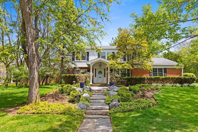 1305 Sleepy Hollow Rd, Glenview, IL 60025 - view of front of property with brick siding and a front lawn