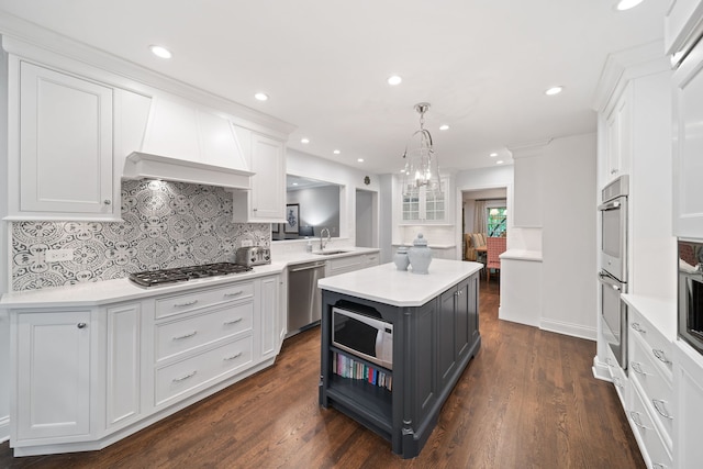 1305 Sleepy Hollow Rd, Glenview, IL 60025 - kitchen featuring stainless steel appliances, white cabinetry, a sink, a center island, and recessed lighting