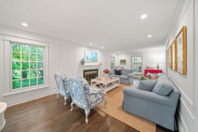 1305 Sleepy Hollow Rd, Glenview, IL 60025 - living room with wood finished floors, a glass covered fireplace, recessed lighting, a decorative wall, and crown molding