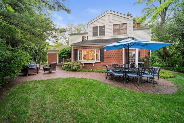 1305 Sleepy Hollow Rd, Glenview, IL 60025 - rear view of house featuring brick siding, a patio area, and a yard