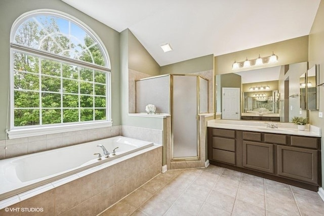 218 Bridle Path Ln, Fox River Grove, IL 60021 - bathroom with tile patterned flooring, a bath, vaulted ceiling, a shower stall, and vanity