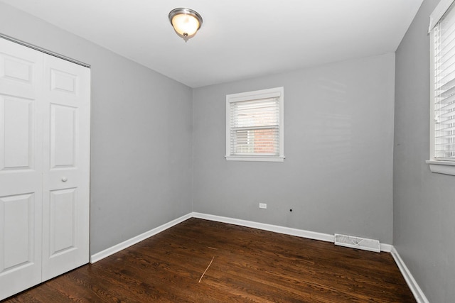7650 Lavergne Ave, Burbank, IL 60459 - unfurnished bedroom featuring dark wood-style floors and baseboards