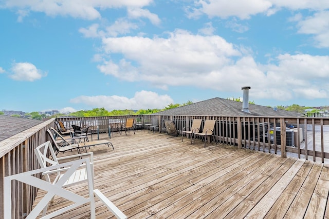 wooden terrace featuring central air condition unit