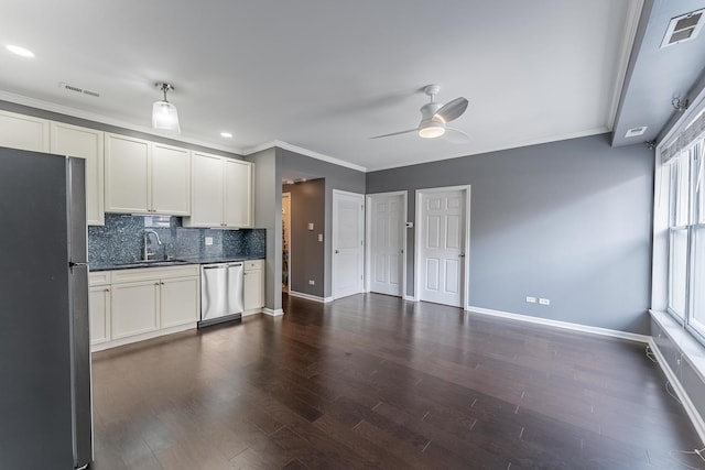 kitchen with stainless steel appliances, ornamental molding, baseboards, dark countertops, and decorative backsplash