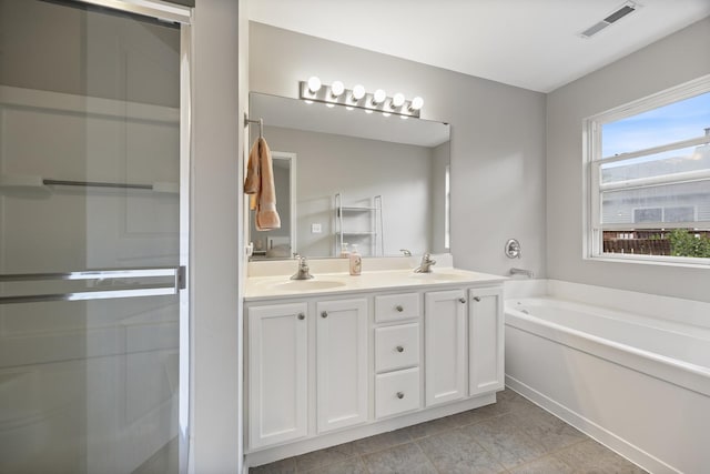 3132 Ollerton Ave, Aurora, IL 60502 - full bath featuring double vanity, a garden tub, a stall shower, and tile patterned floors