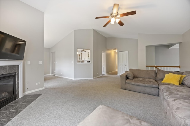 3132 Ollerton Ave, Aurora, IL 60502 - carpeted living room featuring vaulted ceiling, a ceiling fan, a tile fireplace, and baseboards