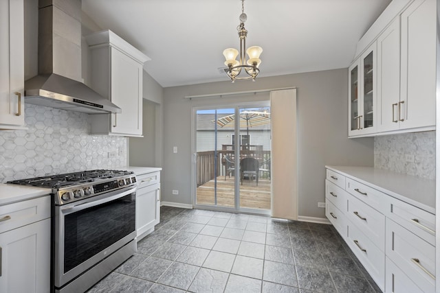 3132 Ollerton Ave, Aurora, IL 60502 - kitchen with wall chimney exhaust hood, gas stove, a chandelier, light countertops, and tasteful backsplash