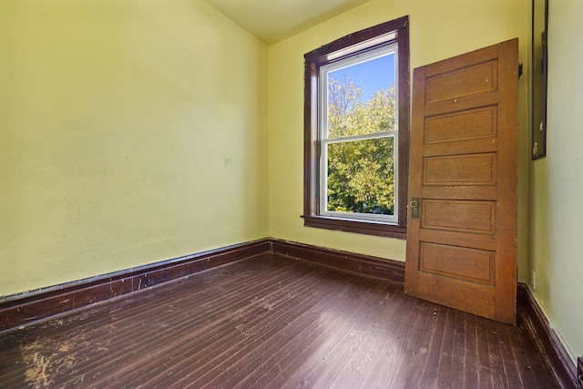 4321 W Maypole Ave, Chicago, IL 60624 - empty room featuring dark wood-style floors and baseboards