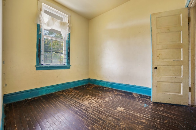 4321 W Maypole Ave, Chicago, IL 60624 - spare room featuring wood-type flooring and baseboards