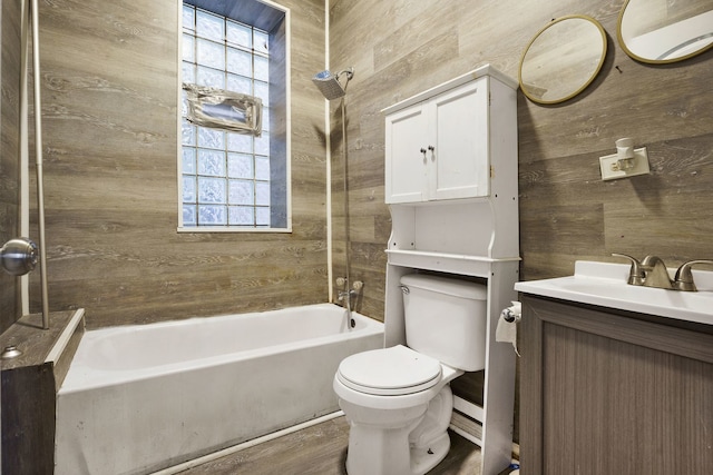 4321 W Maypole Ave, Chicago, IL 60624 - full bathroom with wooden walls, toilet, vanity, washtub / shower combination, and wood finished floors