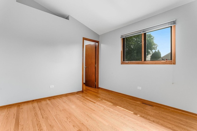 1936 Sybil Dr, Crest Hill, IL 60403 - unfurnished room featuring lofted ceiling, light wood-type flooring, and baseboards
