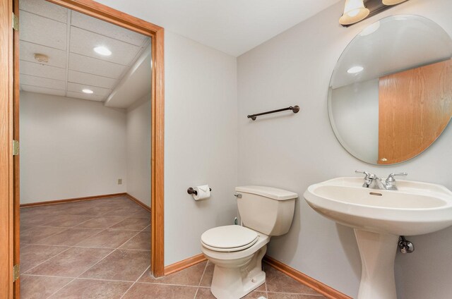 1936 Sybil Dr, Crest Hill, IL 60403 - half bathroom with toilet, baseboards, recessed lighting, and tile patterned flooring