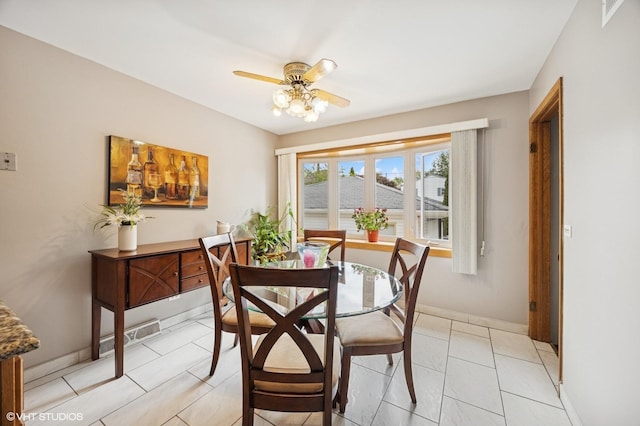769 N Eastland St, Elmhurst, IL 60126 - dining space with a ceiling fan and baseboards