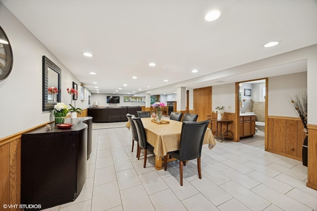 769 N Eastland St, Elmhurst, IL 60126 - dining room featuring a wainscoted wall, recessed lighting, wood walls, and light tile patterned floors