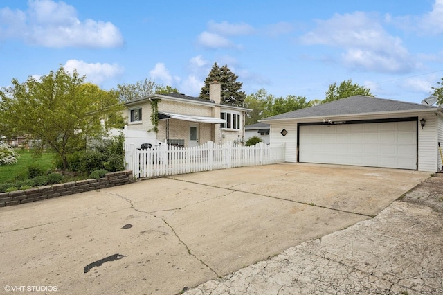 769 N Eastland St, Elmhurst, IL 60126 - view of front of home with fence, a garage, a chimney, and brick siding