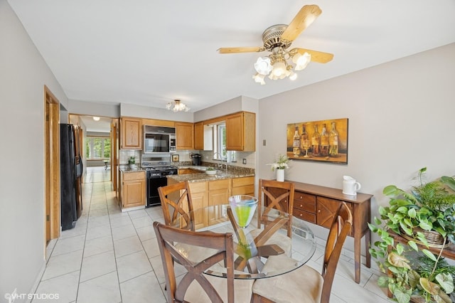 769 N Eastland St, Elmhurst, IL 60126 - dining area with light tile patterned floors and a ceiling fan