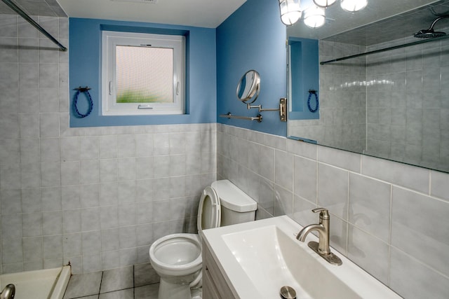 5416 N Neva Ave, Chicago, IL 60656 - bathroom featuring tile walls, a tile shower, toilet, and vanity