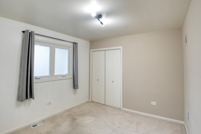 5416 N Neva Ave, Chicago, IL 60656 - unfurnished bedroom with light colored carpet, baseboards, and a closet
