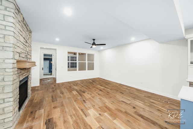 715 N Brainard St, Naperville, IL 60563 - unfurnished living room with a fireplace, a ceiling fan, light wood finished floors, and recessed lighting
