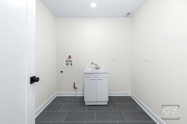715 N Brainard St, Naperville, IL 60563 - laundry area with hookup for a washing machine, dark tile patterned flooring, and recessed lighting