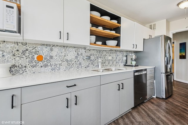 5415 N Sheridan Rd Unit 5011, Chicago, IL 60640 - kitchen featuring stainless steel appliances, dark wood finished floors, gray cabinetry, and a sink