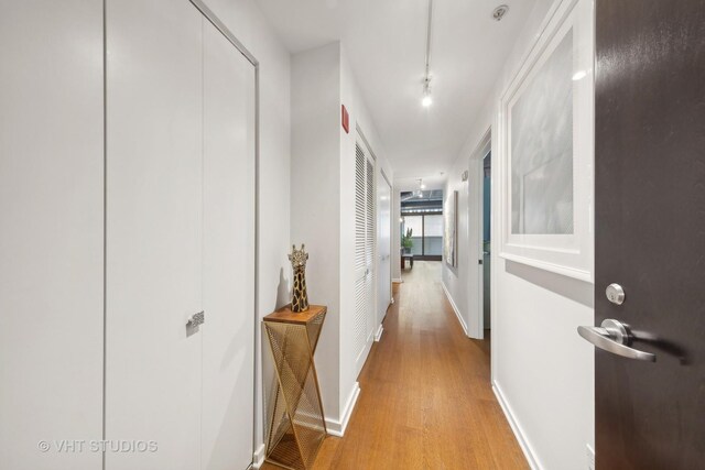240 E Illinois St Unit 402, Chicago, IL 60611 - corridor with light wood finished floors and baseboards