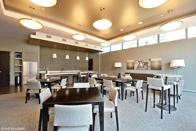 240 E Illinois St Unit 402, Chicago, IL 60611 - dining area featuring carpet and a tray ceiling