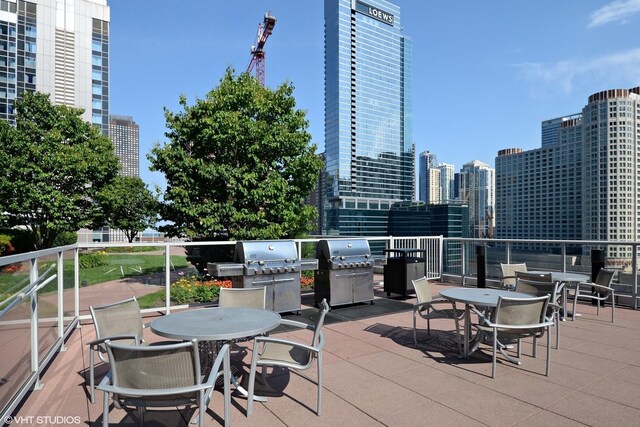 240 E Illinois St Unit 402, Chicago, IL 60611 - view of patio with grilling area and a city view