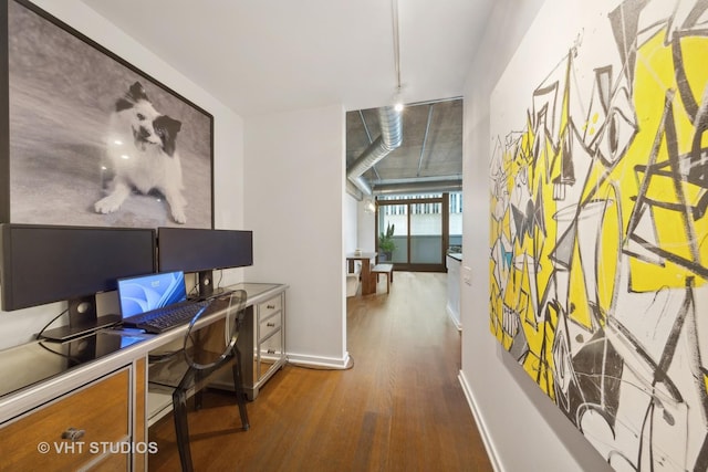 240 E Illinois St Unit 402, Chicago, IL 60611 - home office with dark wood-style flooring and baseboards