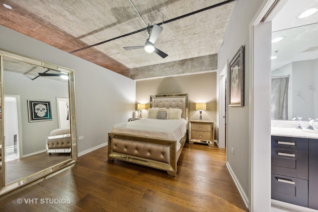 240 E Illinois St Unit 402, Chicago, IL 60611 - bedroom with wood finished floors, a sink, baseboards, ensuite bathroom, and a ceiling fan
