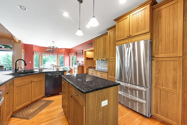 4916 Country Springs Dr, Johnsburg, IL 60051 - kitchen featuring freestanding refrigerator, dishwasher, a sink, a center island, and light wood-style floors