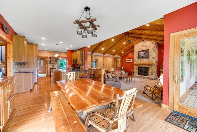 4916 Country Springs Dr, Johnsburg, IL 60051 - dining room featuring light wood-type flooring, a chandelier, recessed lighting, and a stone fireplace