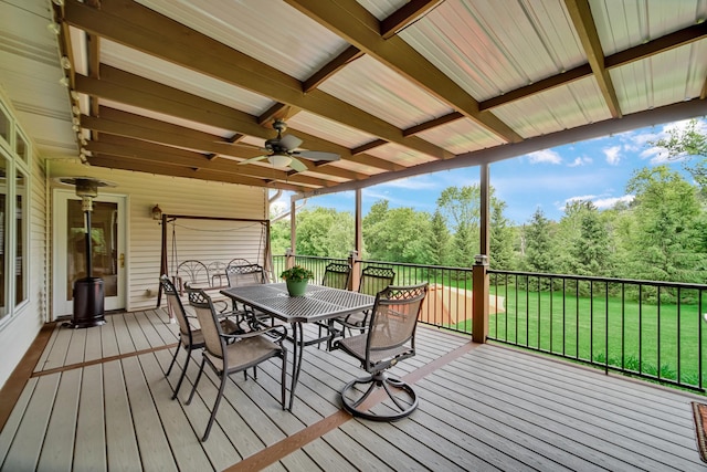 4916 Country Springs Dr, Johnsburg, IL 60051 - deck with outdoor dining space, a ceiling fan, and a lawn