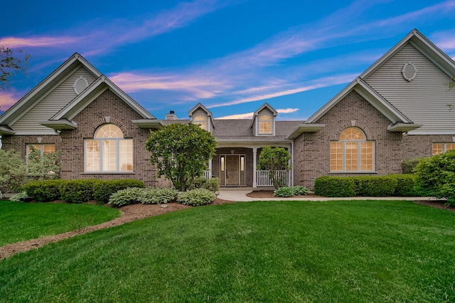 4916 Country Springs Dr, Johnsburg, IL 60051 - single story home with brick siding, a front lawn, and a porch
