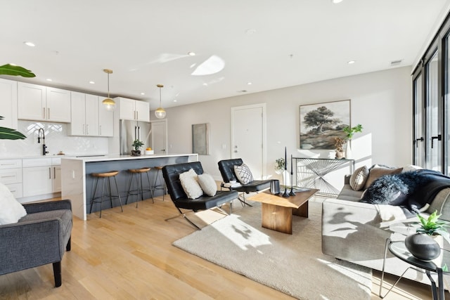 2212 W Lawrence Ave Unit 2W, Chicago, IL 60625 - living area featuring light wood-type flooring and recessed lighting
