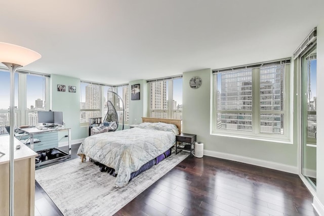 345 N Lasalle Blvd Unit 3602, Chicago, IL 60654 - bedroom featuring baseboards, an office area, and wood finished floors