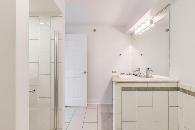 345 N Lasalle Blvd Unit 3602, Chicago, IL 60654 - bathroom with double vanity, a shower with shower door, tile patterned floors, and baseboards