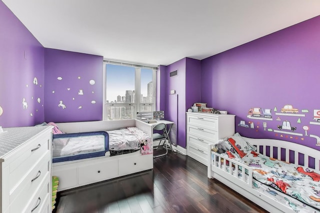345 N Lasalle Blvd Unit 3602, Chicago, IL 60654 - bedroom featuring dark wood-style floors, baseboards, and a city view