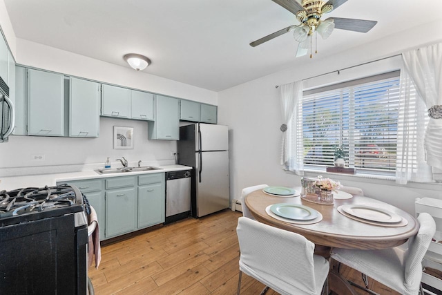 1331 S Finley Rd Unit 114, Lombard, IL 60148 - kitchen featuring stainless steel appliances, a sink, light countertops, a ceiling fan, and light wood-type flooring