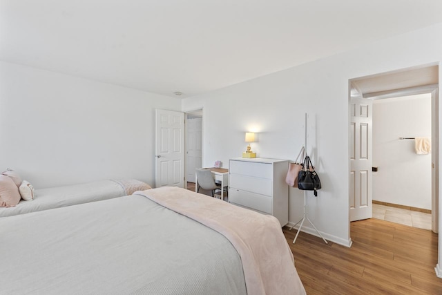 1331 S Finley Rd Unit 114, Lombard, IL 60148 - bedroom with wood finished floors and baseboards