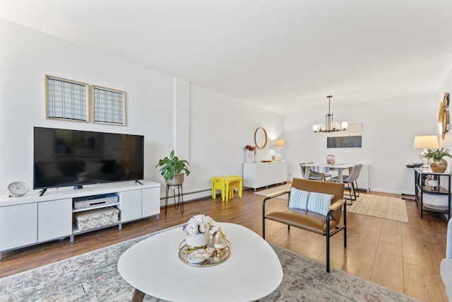 1331 S Finley Rd Unit 114, Lombard, IL 60148 - living area featuring a chandelier, wood finished floors, and a baseboard heating unit