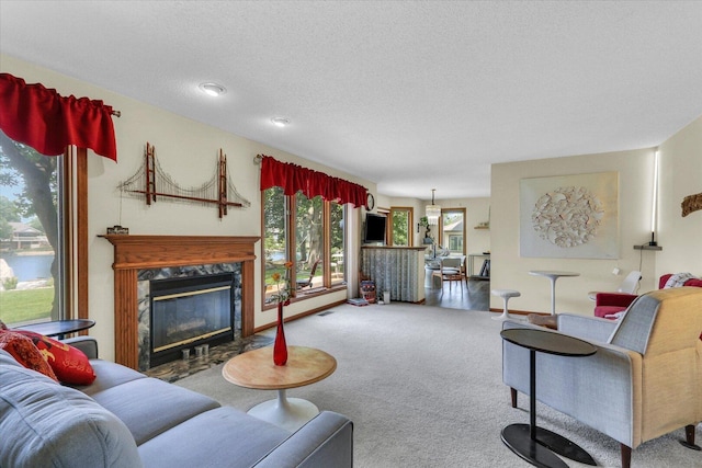 4008 Pinecrest Dr, Champaign, IL 61822 - carpeted living area with a high end fireplace and a textured ceiling