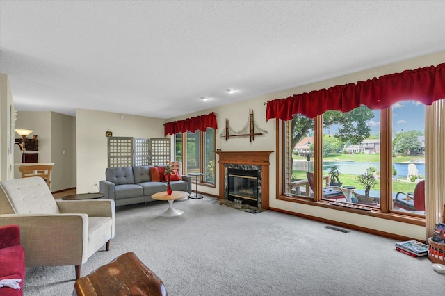 4008 Pinecrest Dr, Champaign, IL 61822 - living area featuring carpet flooring, a high end fireplace, baseboards, and a textured ceiling