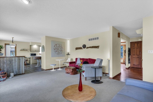 4008 Pinecrest Dr, Champaign, IL 61822 - living area featuring dark carpet and a textured ceiling