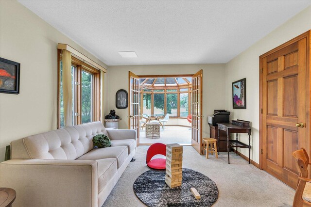 4008 Pinecrest Dr, Champaign, IL 61822 - carpeted living area featuring baseboards, a textured ceiling, and an office area