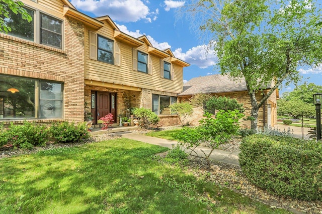 4008 Pinecrest Dr, Champaign, IL 61822 - view of front of house featuring brick siding and a front yard