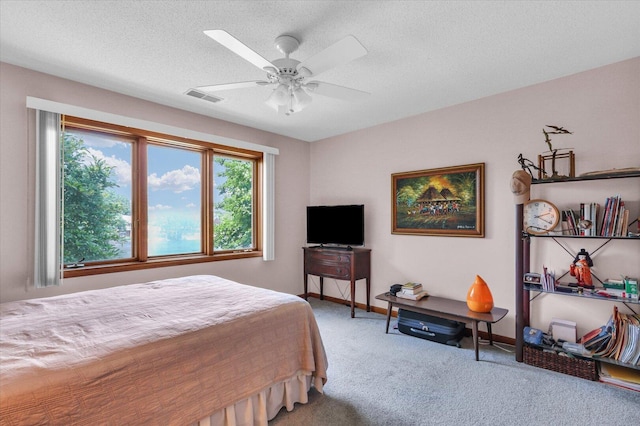 4008 Pinecrest Dr, Champaign, IL 61822 - carpeted bedroom featuring a ceiling fan and a textured ceiling